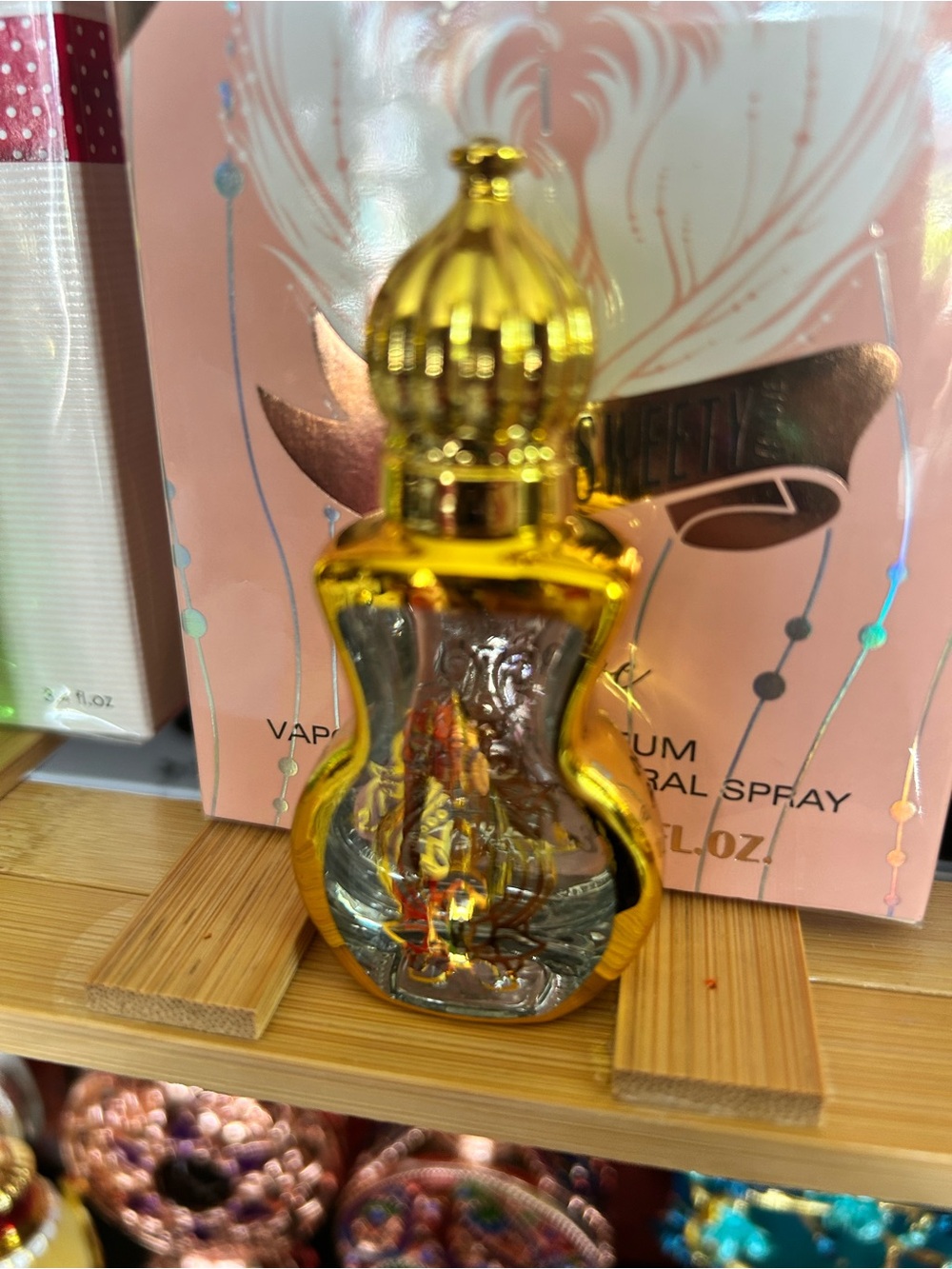 Glass rollerball perfume container.